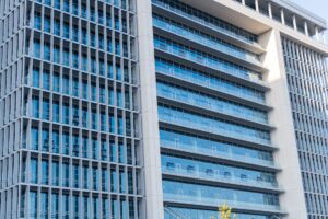 Modern commercial real estate building representing collateralized property assets