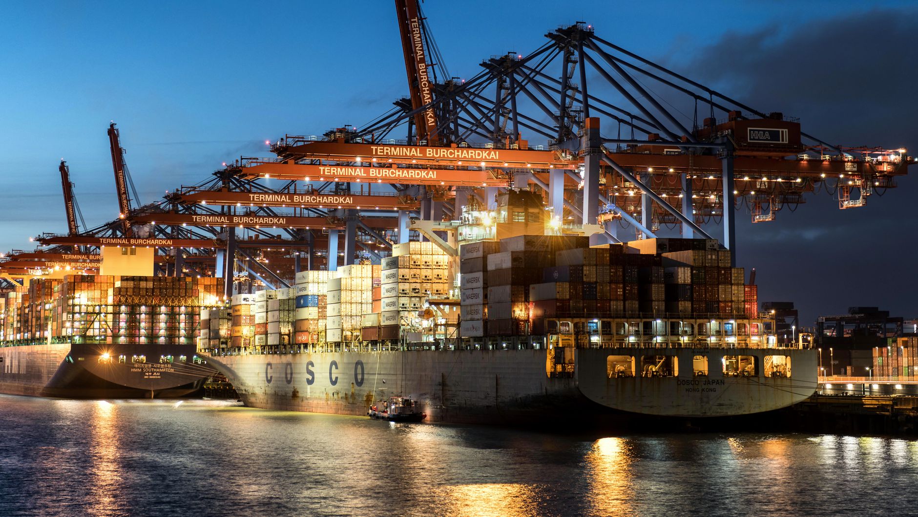 Cargo ship docked at a commercial port representing global commodity trade and supply chain financing
