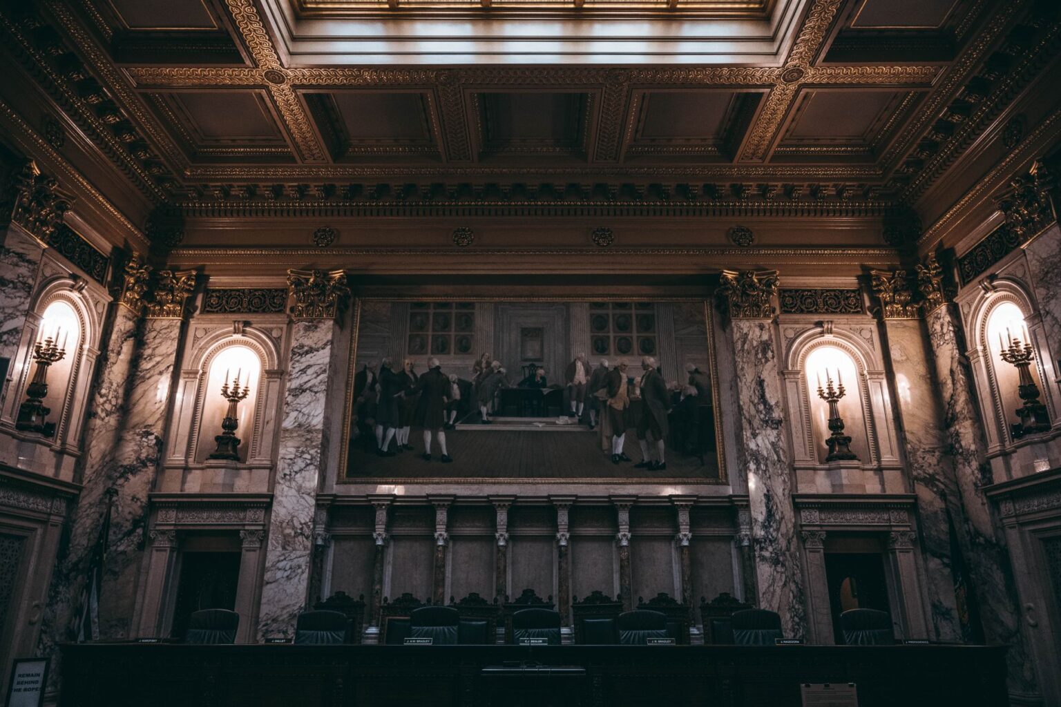 Litigation Finance Funds Quietly Draw Institutional Allocators Seeking Uncorrelated Returns Empty courtroom with wooden benches and judge's bench representing litigation and legal proceedings