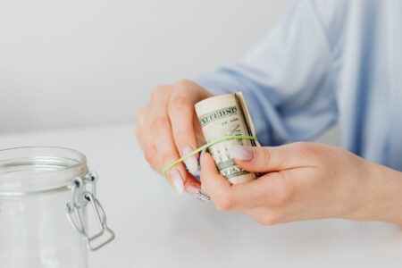 Inflation-Linked Savings Bonds Quietly Resurface Among Cautious Retail Allocators Paper savings bonds and financial documents on a desk representing inflation-protected investments