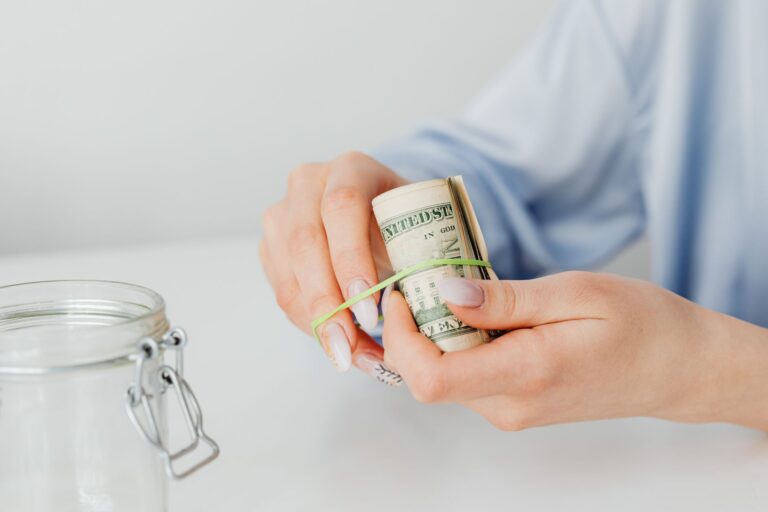 Inflation-Linked Savings Bonds Quietly Resurface Among Cautious Retail Allocators Paper savings bonds and financial documents on a desk representing inflation-protected investments