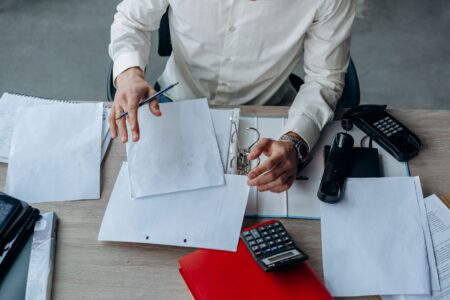 Mortgage Revenue Bonds Quietly Draw Tax-Sensitive Income Allocators Mortgage documents and financial paperwork on a desk representing housing bond investments