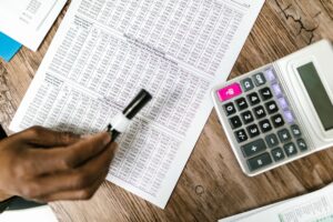 Financial documents and charts representing distressed debt analysis on a desk