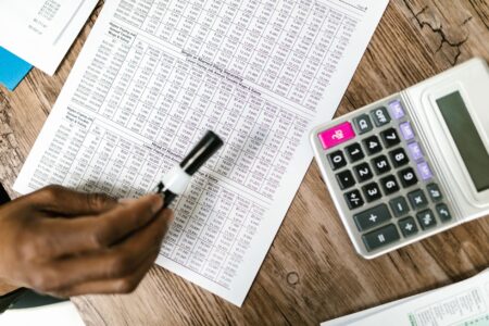 Financial documents and charts representing distressed debt analysis on a desk