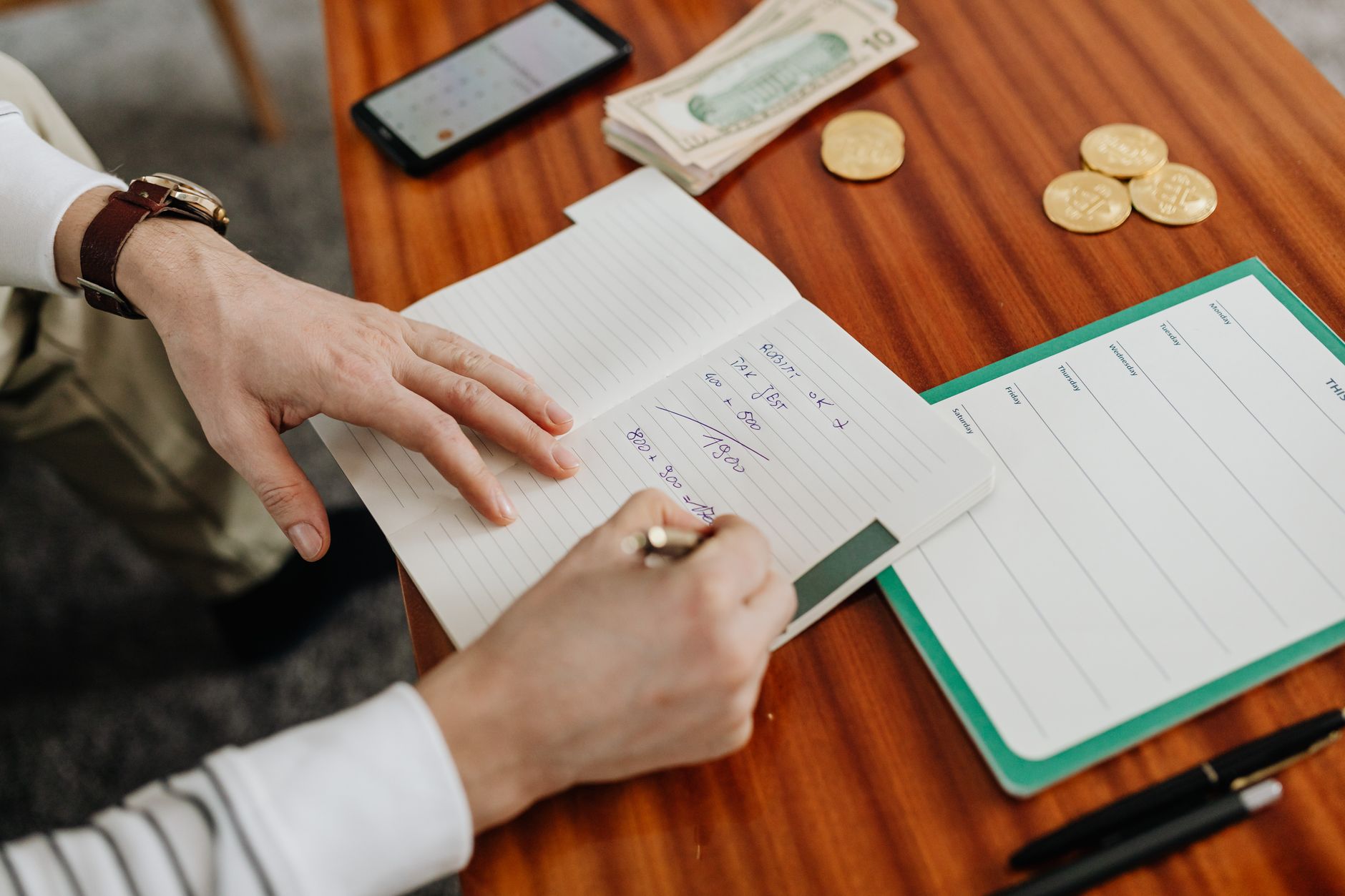 Person reviewing investment ladder strategy documents at a desk