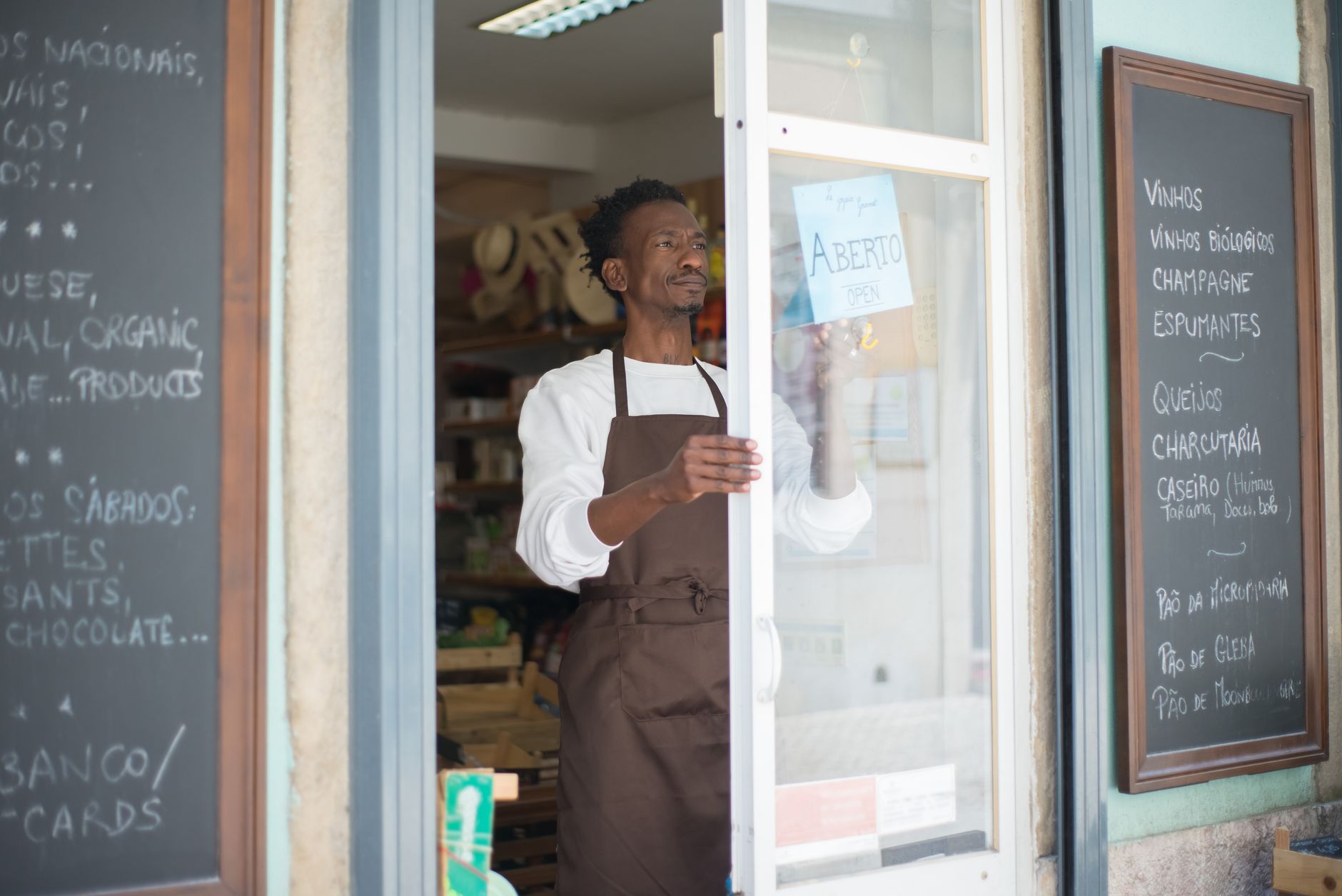 A small business owner reviewing finances at a desk, representing entrepreneurs managing capital gaps